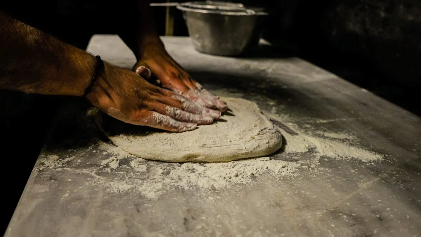 Shaping dough by hand