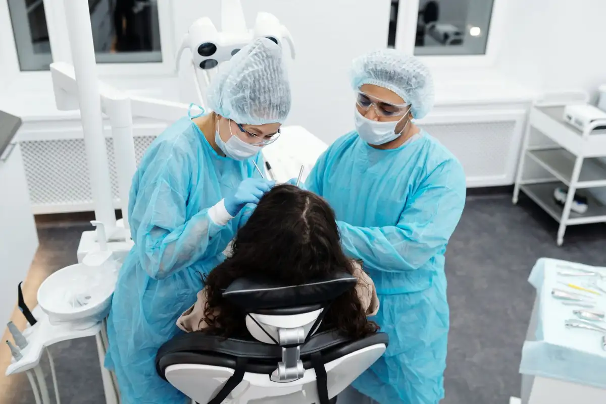 A patient being seen in a bright treatment room