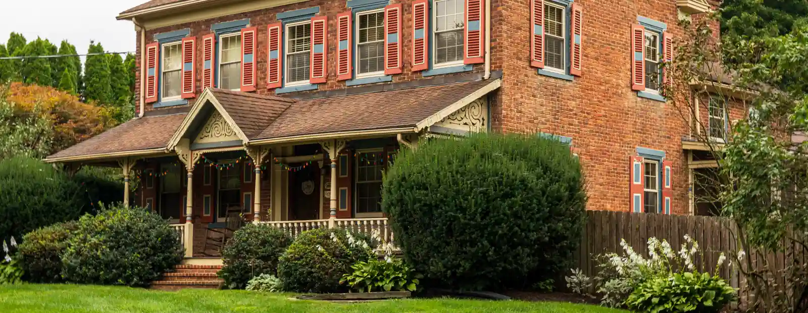 A brick house with a covered porch