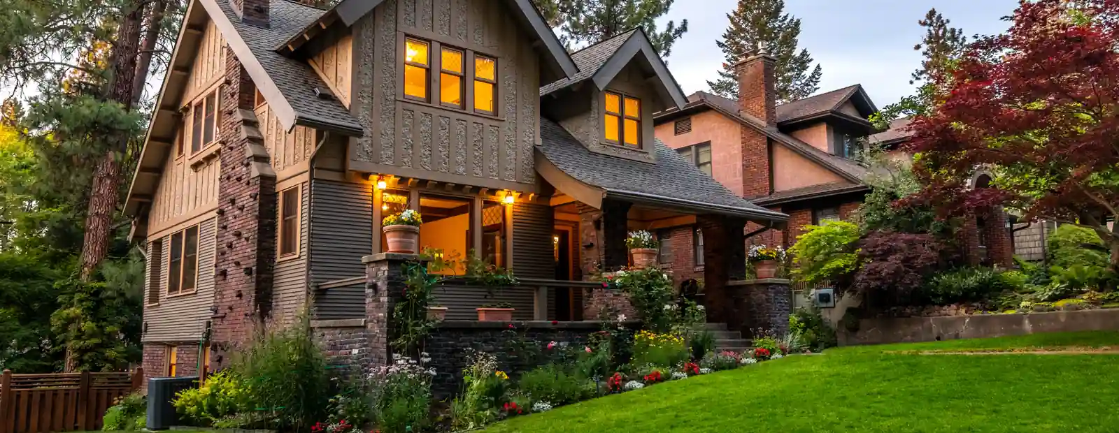 A house at dusk with the lights on