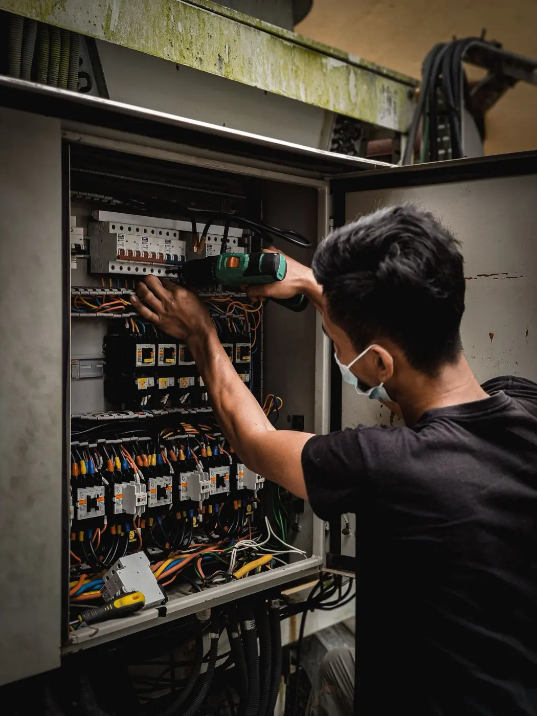 Working inside an opened electrical panel