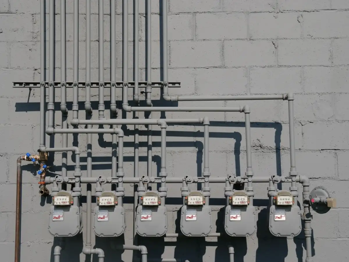 A row of meters and service piping