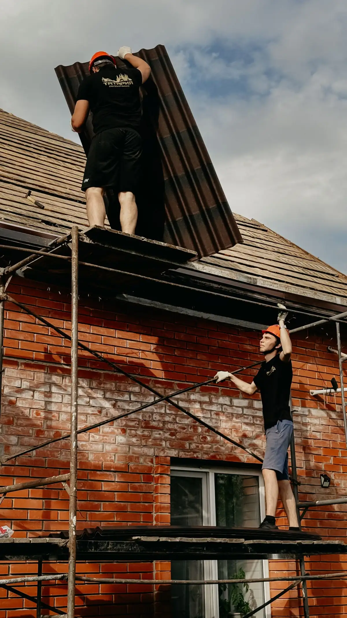 A crew working from scaffolding